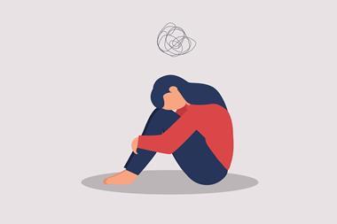 Girl with head in hands under negative thought cloud